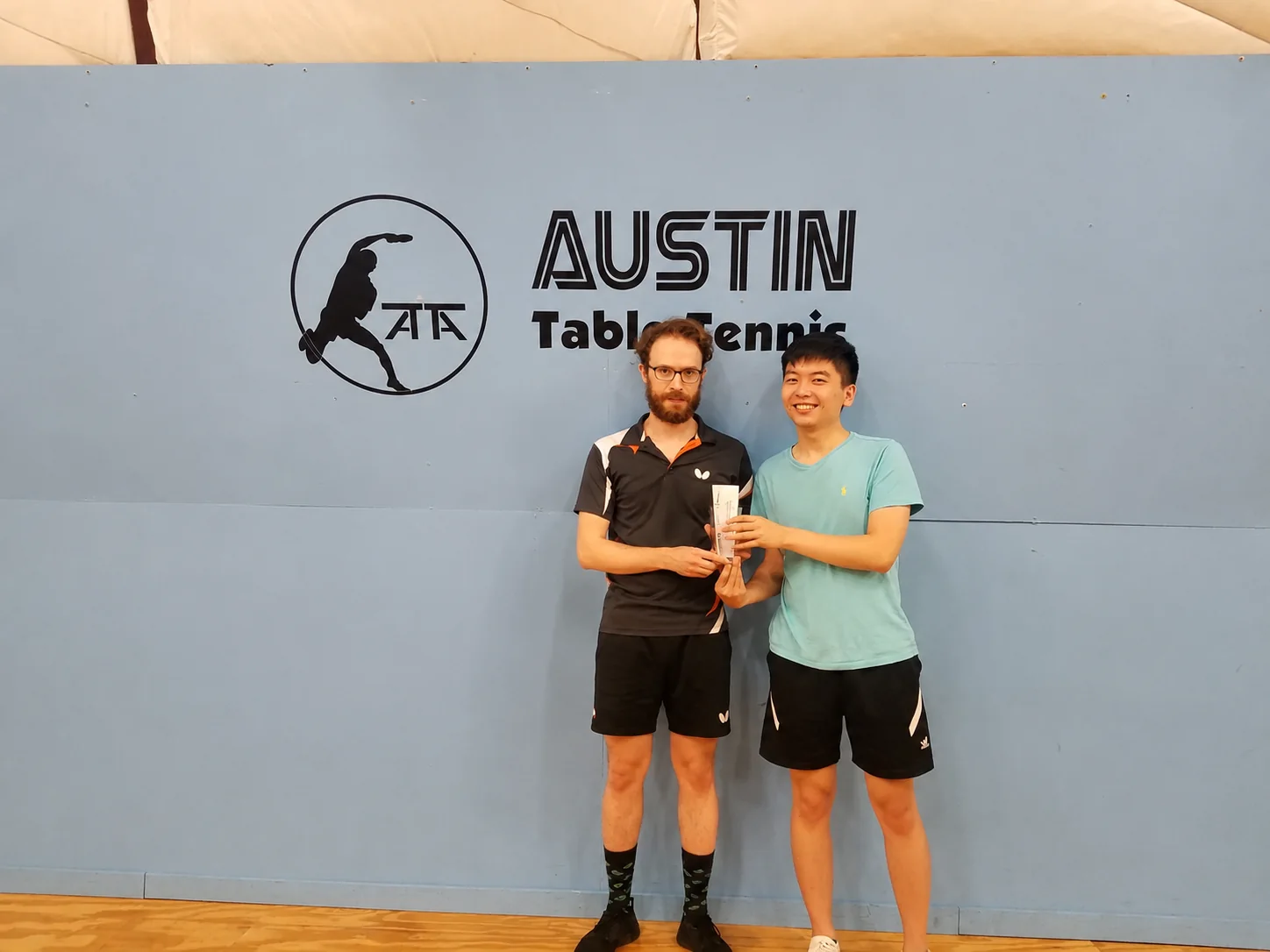 Colin and his doubles partner receiving their ATTC championship award